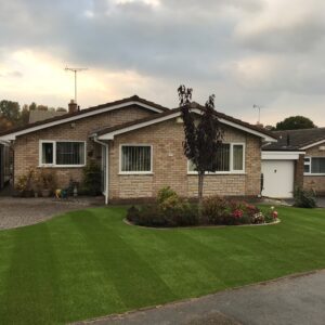Stripes brushed into artificial grass